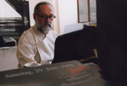 Joop working on the piano as an artist in residence in the Kunsthaus Horn.